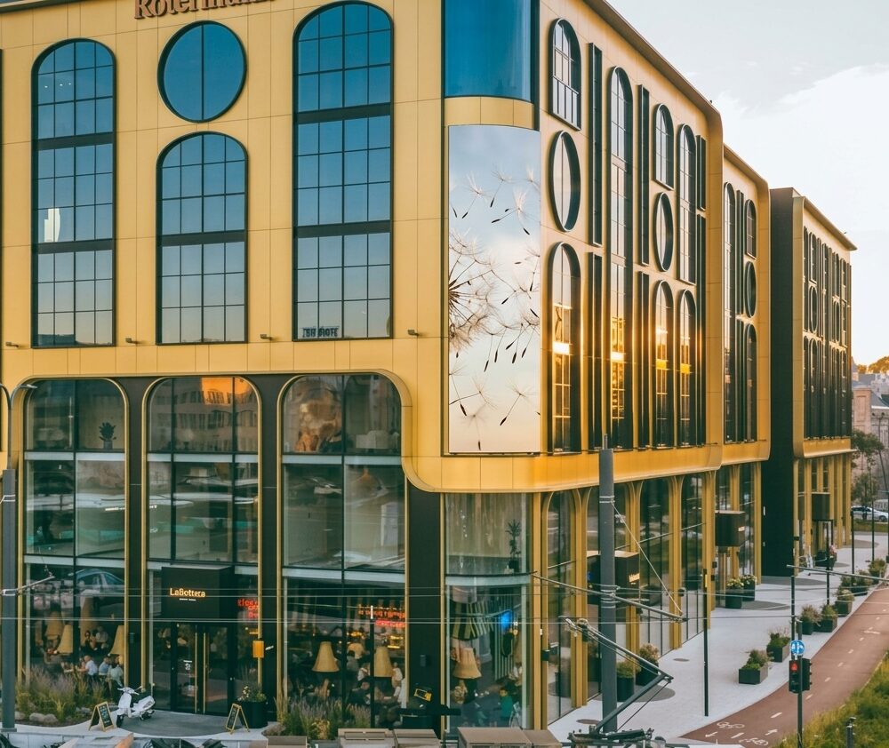 Golden Gate facade with tall arched windows above a glazed ground floor