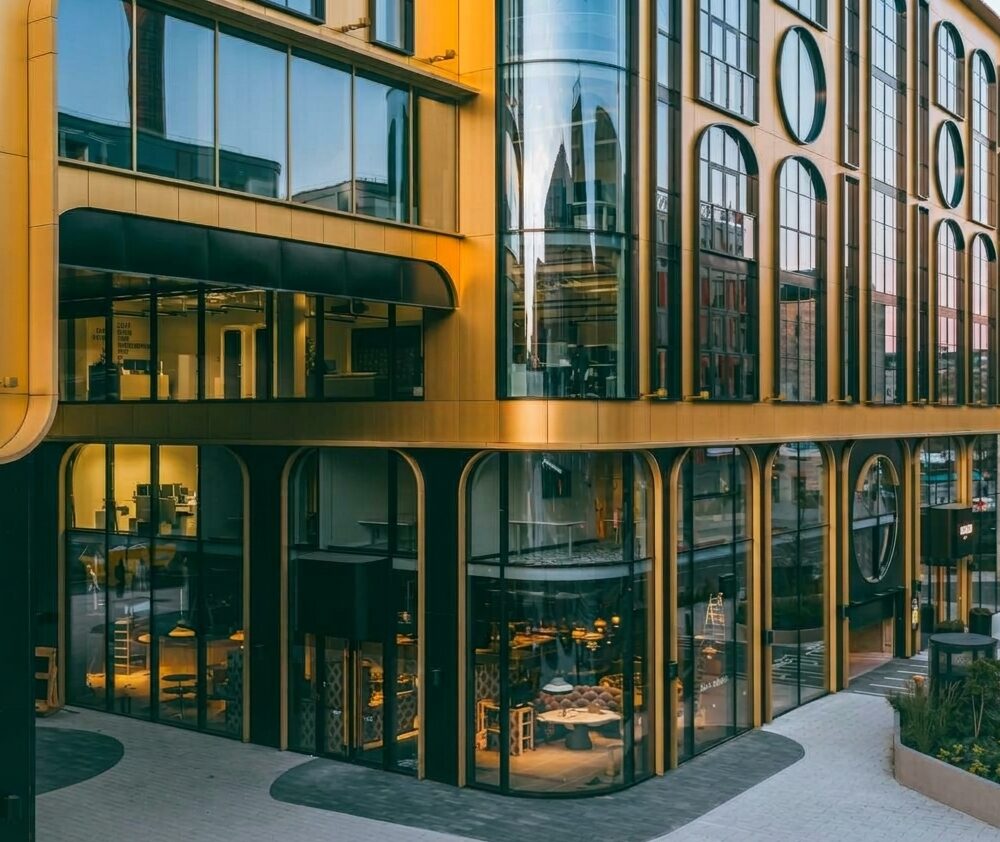Curved gold facade corner and glazed shopfronts of Golden Gate