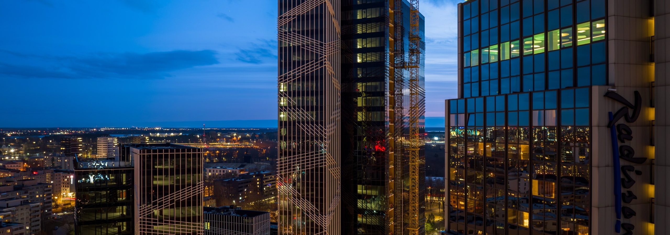 Glass facade towers in Tallinn at dusk