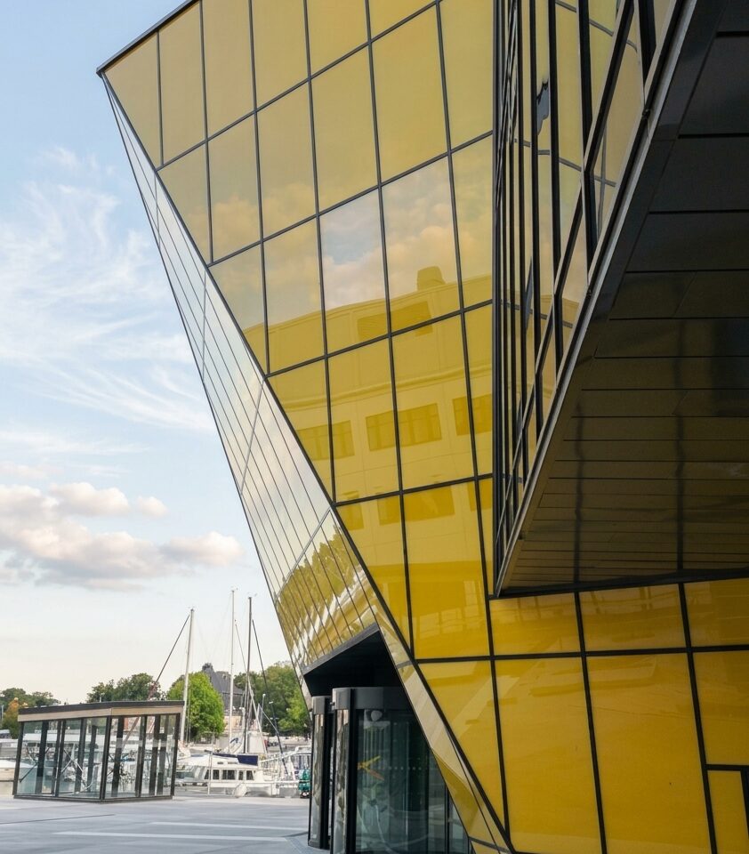 Sloping corner of the yellow facade at Linnaeus University by Kalmar harbour