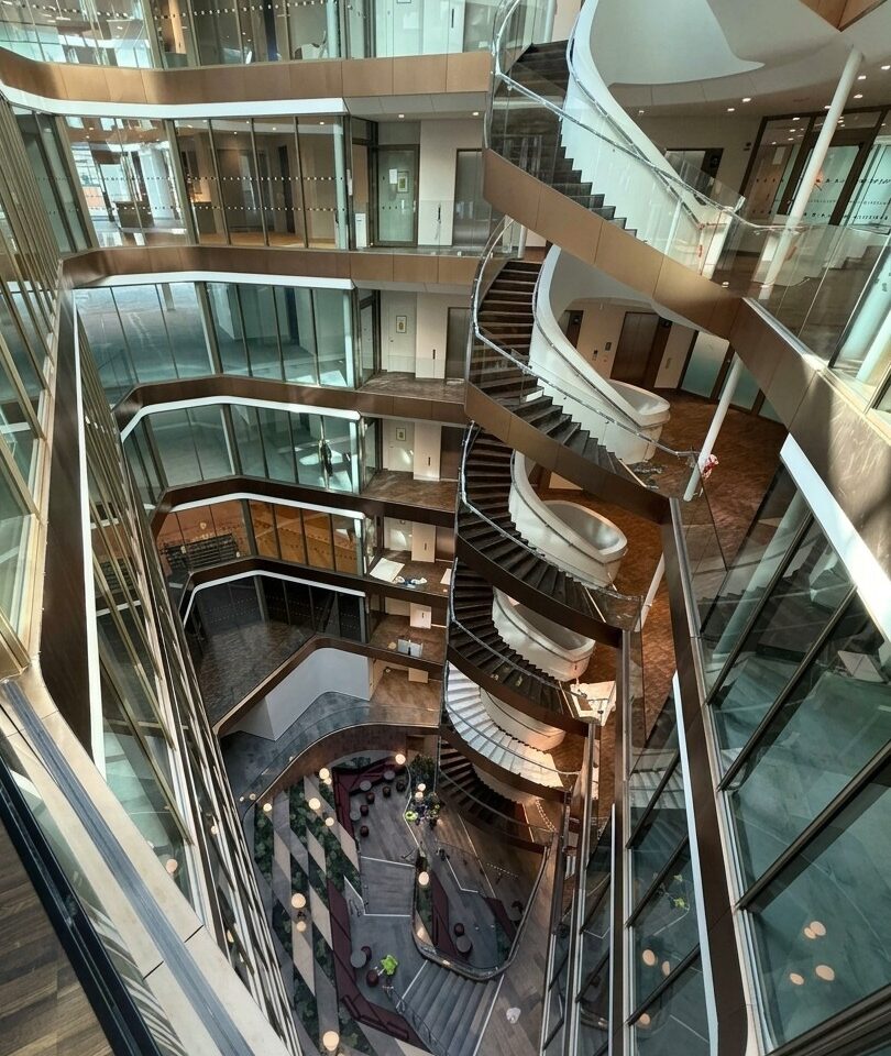 Spiral staircase and glass atrium facades inside Snäckan 8